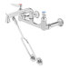 A T&S polished chrome wall mount mop sink faucet.