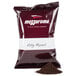 A red Ellis Mezzaroma City Roast Coffee bag on a table with a pile of ground coffee.
