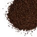 A pile of Ellis Mezzaroma City Roast coffee granules on a white background.