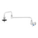 A T&S stainless steel wall mount pot filler faucet with a 4 arm handle.