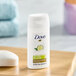 A small 0.75 oz bottle of Dove Cool Moisture Cucumber body wash designed for hotel and motel use.