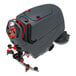 A large industrial floor scrubber with a grey and red design, featuring a control panel, wheels, and a rear squeegee attachment.