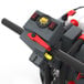 A control panel of a walk-behind disc floor scrubber with a display, switches, and handlebar.