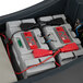A pair of NX1K lithium-ion batteries installed in a NaceCare walk-behind disc floor scrubber.
