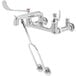 A chrome T&S mop sink faucet with wrist action handles.