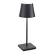 A dark gray cordless rechargeable table lamp with a square base and conical shade.