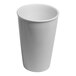 A plain ivory porcelain soda mug with a tall, tapered design.
