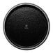 A small round black porcelain plate with a textured surface.