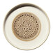 A round porcelain plate with a brown and cream design and a raised rim.