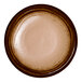 A brown round porcelain flat plate with a wide rim.