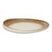 An irregular oval porcelain platter with a brown and cream spotted rim and a raised edge.