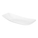 A white, asymmetric rectangular porcelain platter with raised rims.