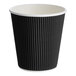 A black double wall ripple paper hot cup with a 10 oz. capacity.