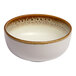 A round porcelain coupe bowl with a brown and cream color scheme and a spotted rim.