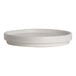 A round, white porcelain stack plate with a slightly raised rim.