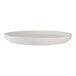 A round, white porcelain plate with a slightly raised rim.