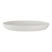 A round, white porcelain plate with a slightly raised rim.