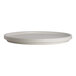 A round, white porcelain stack plate with a slightly raised rim.