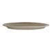 A large oval porcelain platter in a neutral tone.