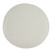 A round, off-white porcelain coupe plate with a smooth, slightly irregular edge.