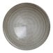 A round, gray porcelain coupe plate with a subtle textured pattern.