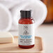 A small bottle of Soapbox Sea Minerals and Blue Iris body wash placed on a wooden tray.