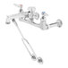 A T&S polished chrome wall mount service sink faucet.