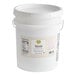 A large white plastic pail containing 40 pounds of Seeds 'n Snacks Premium Tahini Paste.