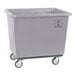 A large gray heavy-duty polypropylene utility cart with four caster wheels.