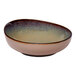 A beige round slanted porcelain coupe bowl with a gradient interior.