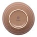 A brown porcelain coupe bowl shown upside down with the Ariane logo on the base.