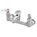 A T&S polished chrome wall mount service sink faucet with two handles.