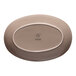An oval beige porcelain coupe platter with the Ariane logo on the bottom.