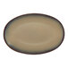 An oval beige porcelain coupe platter with a subtle gradient edge.