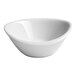 A small ivory porcelain bowl with a curved rim and round rolled edge.