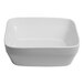 A large ivory square porcelain serving bowl.