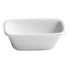 A small ivory rectangular porcelain bowl with tapered sides.