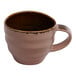 A small blue porcelain espresso cup with a handle.