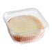 A mini key lime pie in a clear plastic container.