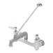 A silver T&S wall mount mop sink faucet with a lever.