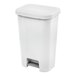 A white rectangular step-on wastebasket with a foot pedal.