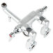 A silver T&S wall mount service sink faucet with multiple handles and screws.