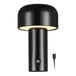 A modern glossy black battery-powered LED table lamp with a cylindrical base and a rounded shade, shown with a USB charging cable.