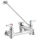 A chrome T&S wall mount mop sink faucet with two long handles.