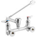 A T&S chrome wall mount mop sink faucet with two handles.