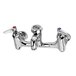 A T&S polished chrome wall mount service sink faucet with two handles.