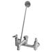 A T&S rough chrome service sink faucet with a long silver handle.