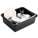 A black Tablecraft bus tub on a table with white dishes and utensils.