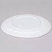A white, irregular round melamine coupe plate shown upside down.