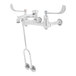 A T&S polished chrome wall mount faucet for a mop sink with two wrist-action handles.